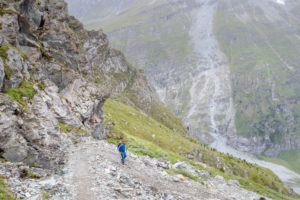 Mountaineer descending from the Tracuit hut, weak and exhausted Mountaineer descending from the Tracuit hut, weak and exhausted